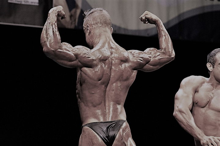 Bodybuilder doing back double biceps pose